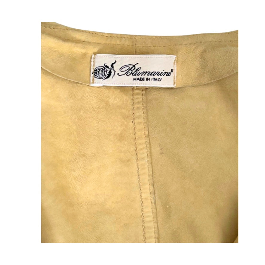 Yellow fabric with Blumarine label on a white background