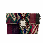 Bohemian woven clutch bag in multicolour geometric design with beaded embellishment on flap.