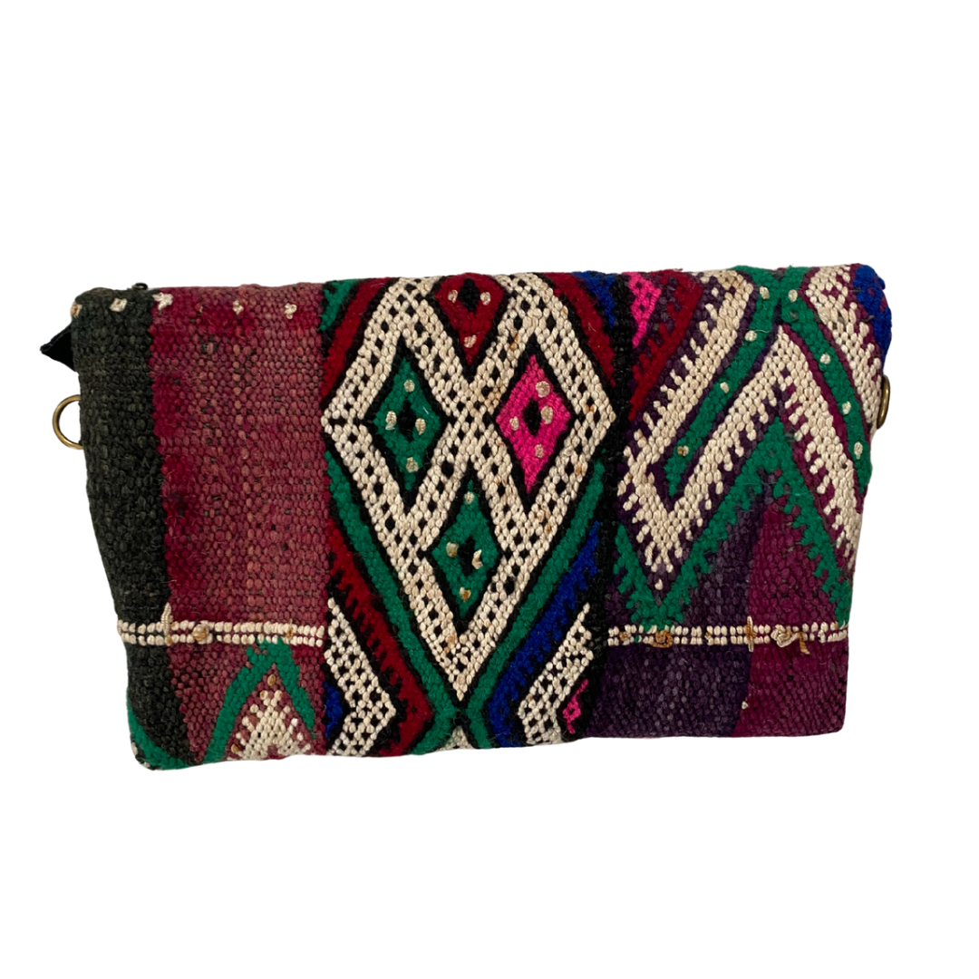 Multicolored patterned clutch bag on a white background