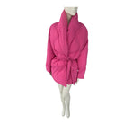 Pink puffer coat on a mannequin against a white background
