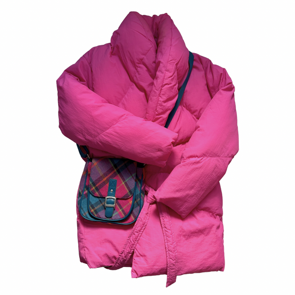Pink puffer jacket with a plaid handbag on a white background