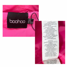 Boohoo label on a pink garment with a close-up of the tag.
