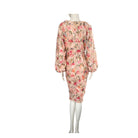 Floral dress on a mannequin against a white background