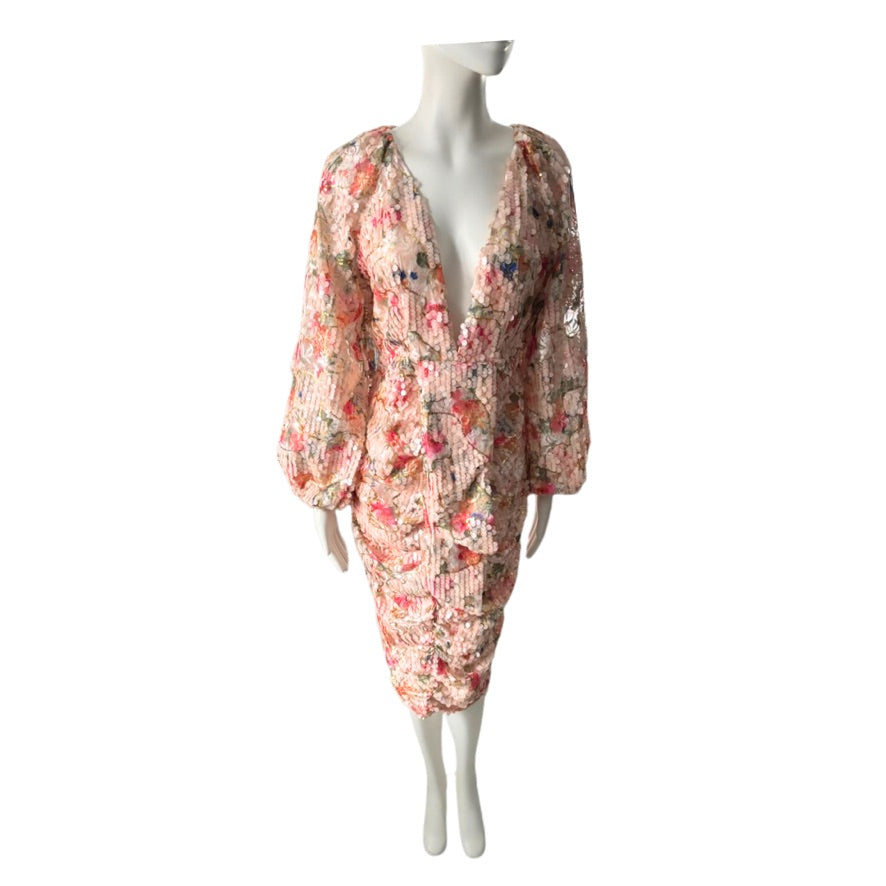 Floral dress on a mannequin against a white background