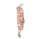 Floral dress on a mannequin against a white background