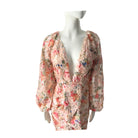 Floral dress on a mannequin against a white background