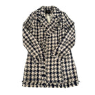 Plaid jacket with a visible brand label on a white background