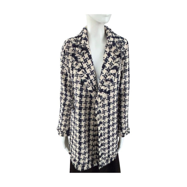 Mannequin wearing a patterned coat on a white background