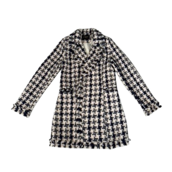 Houndstooth patterned coat on a white background