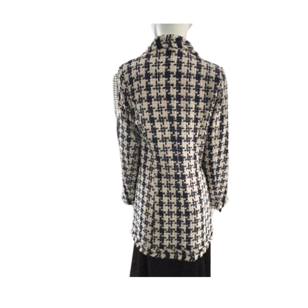 Houndstooth patterned shirt on a mannequin against a white background