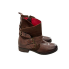 Brown leather boots with buckles on a white background