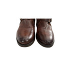 Brown leather boots on a white background