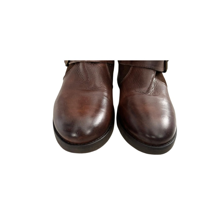Brown leather boots on a white background