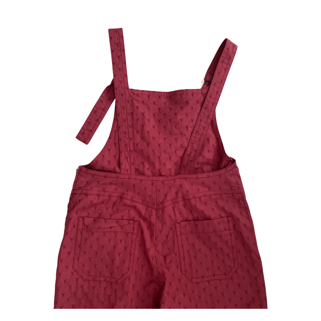 Red textured overalls on a white background
