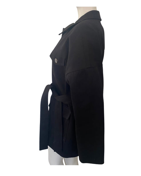 Black coat on a mannequin against a white background