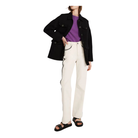 Person wearing a black coat, purple shirt, white pants, and black sandals on a white background