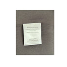 Textile label on a gray fabric background