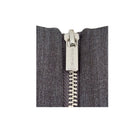 Close-up of a zipper on a gray fabric background