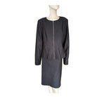 Grey suit on a mannequin against a white background