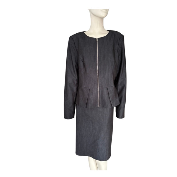 Grey suit on a mannequin against a white background