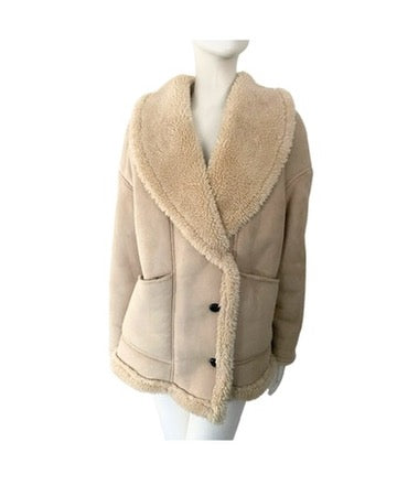 Beige shearling jacket on a mannequin against a white background