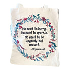 Tote bag with floral design and quote by Virginia Woolf on a white background