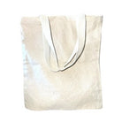 Beige tote bag with white handles on a white background