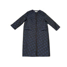 Navy coat with blue polka dot pattern on a white background