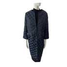 Navy blue patterned coat on a mannequin against a white background