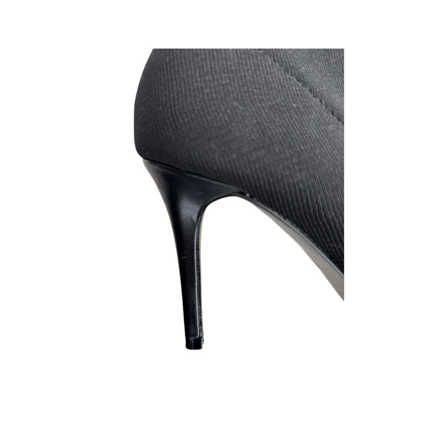 Close-up of a high-heeled shoe with a white background