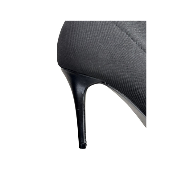 Close-up of a high-heeled shoe with a white background