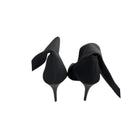 Black high-heeled shoes on a white background