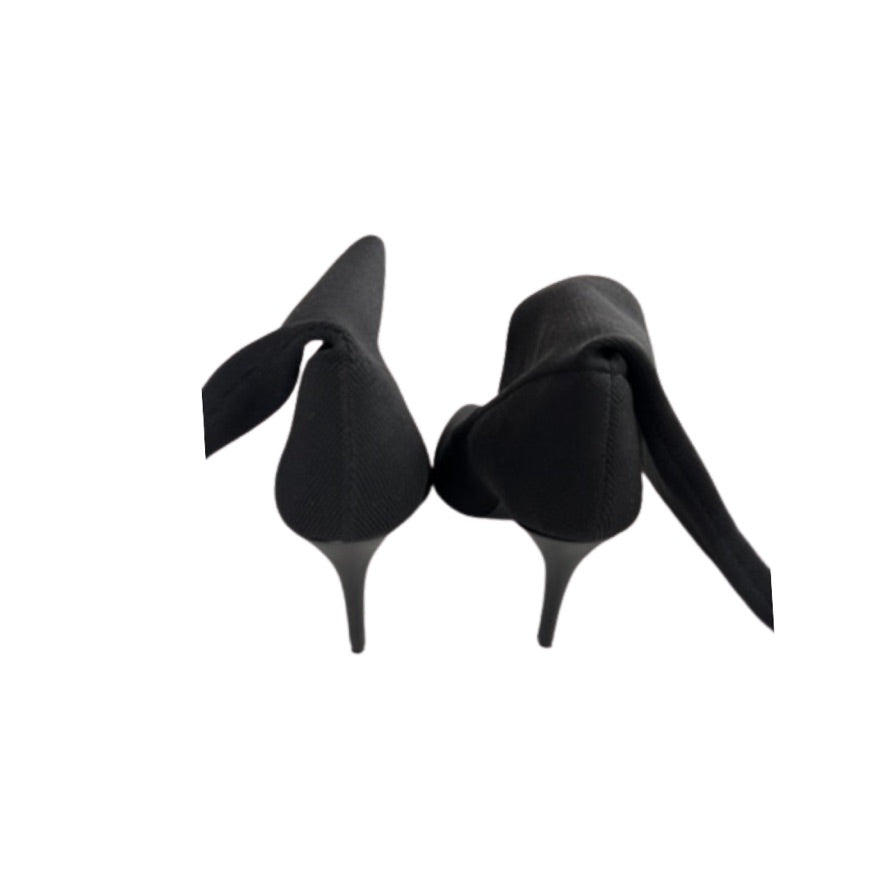 Black high-heeled shoes on a white background