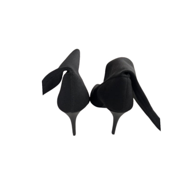 Black high-heeled shoes on a white background