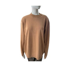 Brown sweater on a mannequin against a white background