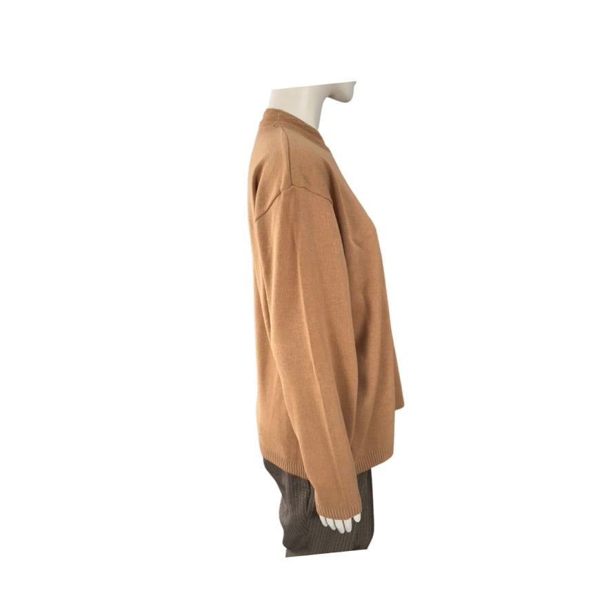 Mannequin wearing a brown sweater on a white background