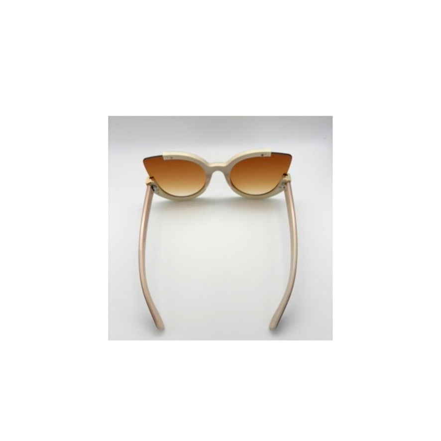 Cat-eye sunglasses with beige frame and brown gradient lenses on a light gray background