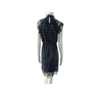 Mannequin wearing a blue plaid dress with lace details on a white background