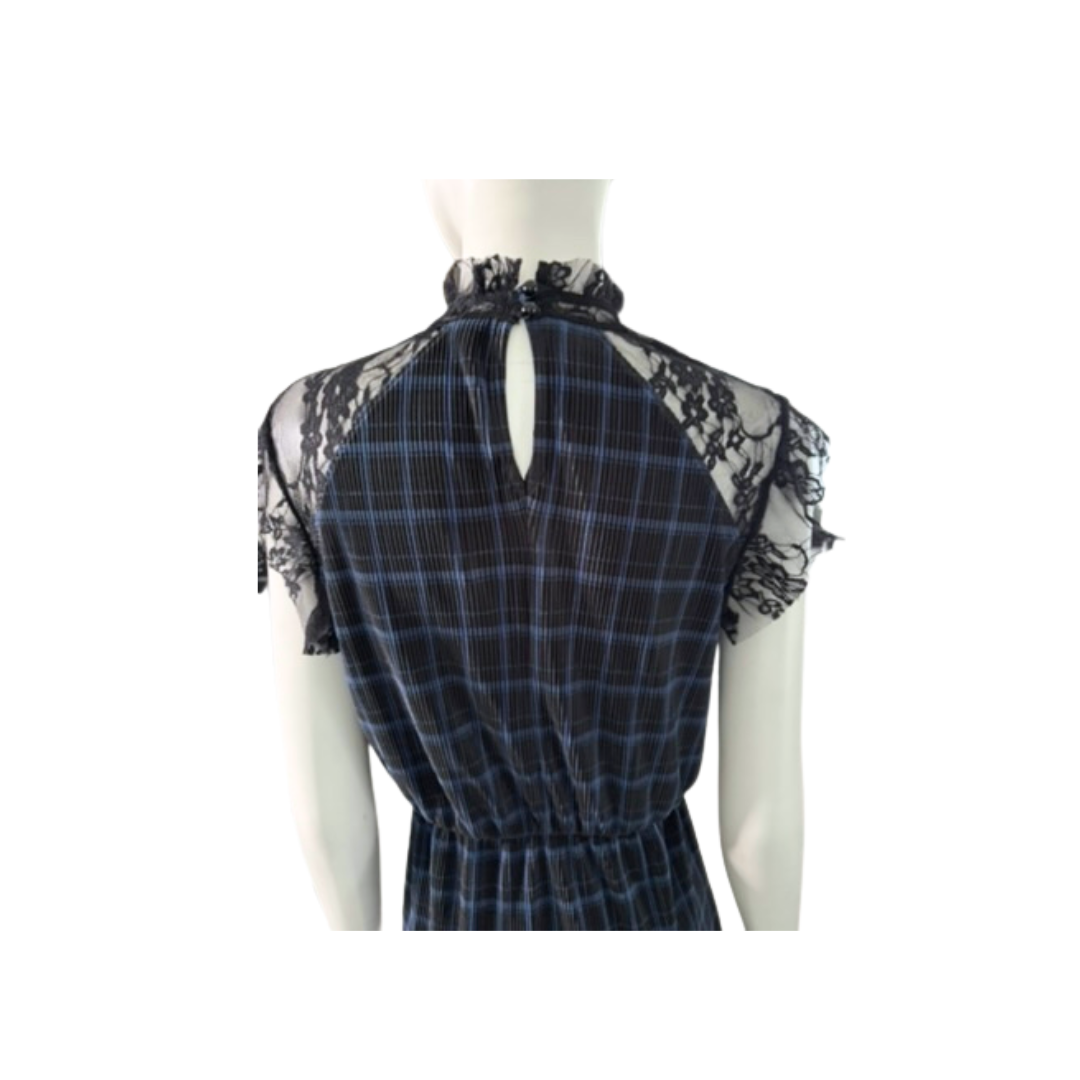 Plaid dress with lace details on a mannequin against a white background