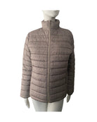 Plaid patterned jacket on a mannequin against a white background