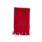 Red scarf with tree design and fringes on a white background