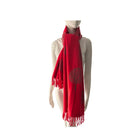 Red scarf with a pattern on a mannequin against a white background