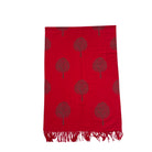 Red scarf with tree pattern and fringes on a white background
