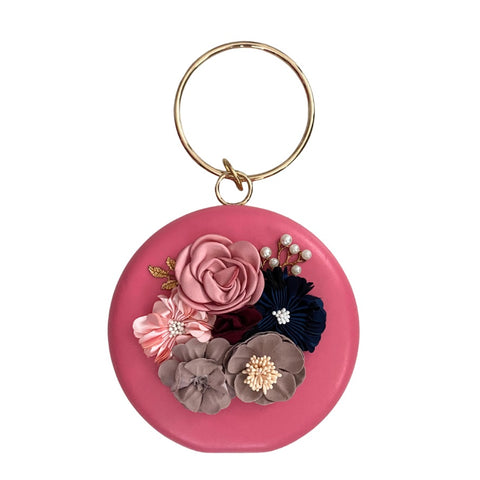 Pink bag with floral decorations on a white background