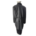 Black leather trench coat on a mannequin against a white background
