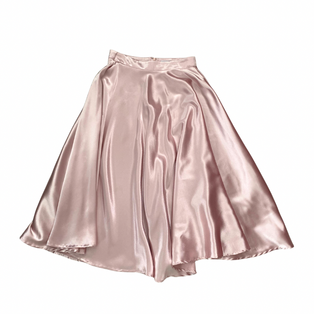 Pink satin skirt on a white background