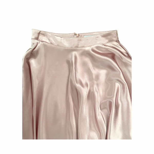 Pink satin skirt on a white background