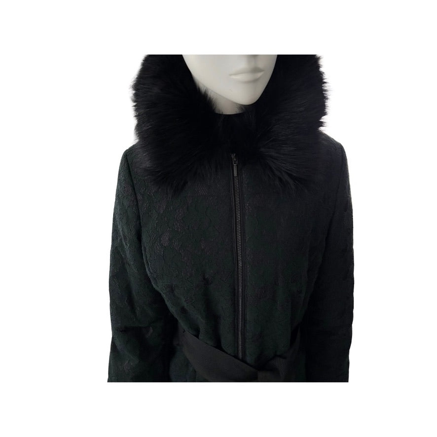Black coat with fur collar on a mannequin against a white background