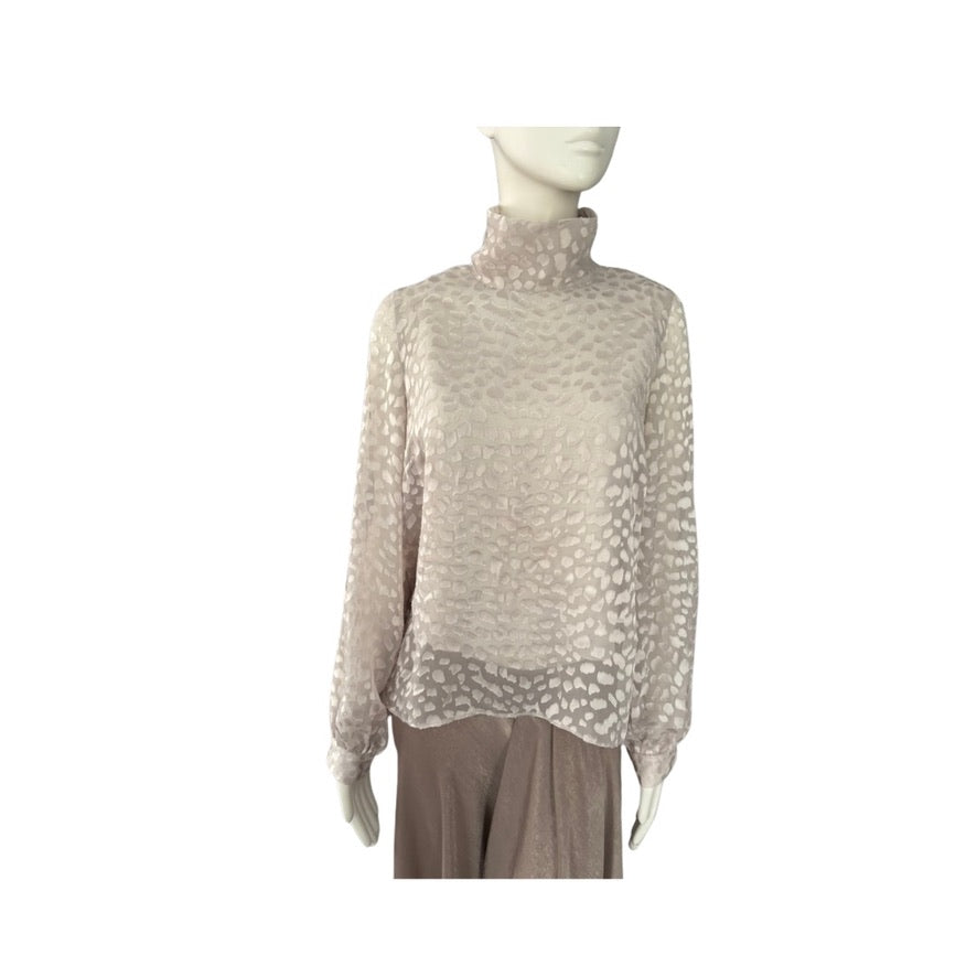 Mannequin wearing a beige turtleneck sweater on a white background