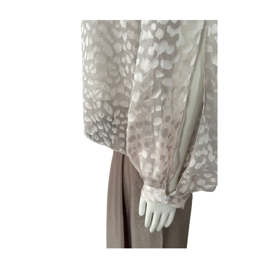 Sheer blouse with floral pattern on a white background